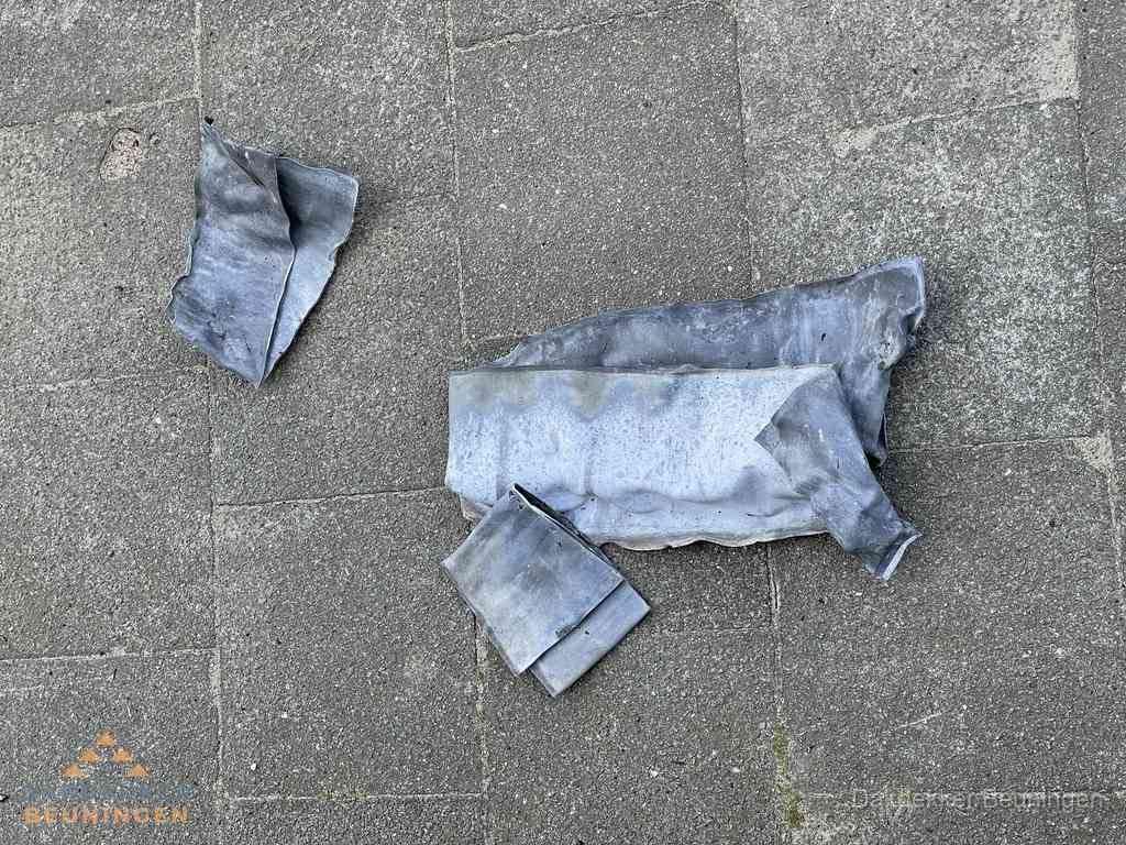 Oude verwijderde loodslabben na vervanging in Beuningen Oude verwijderde loodslabben na vervanging in Beuningen